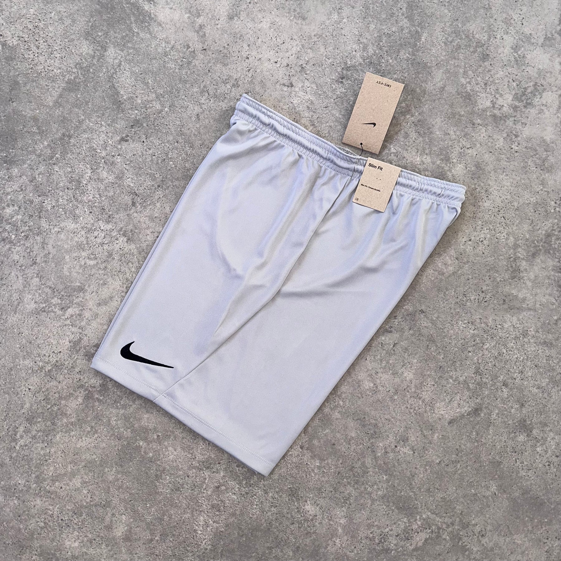 NIKE LOGO ESSENTIAL SHORTS - STONE GREY