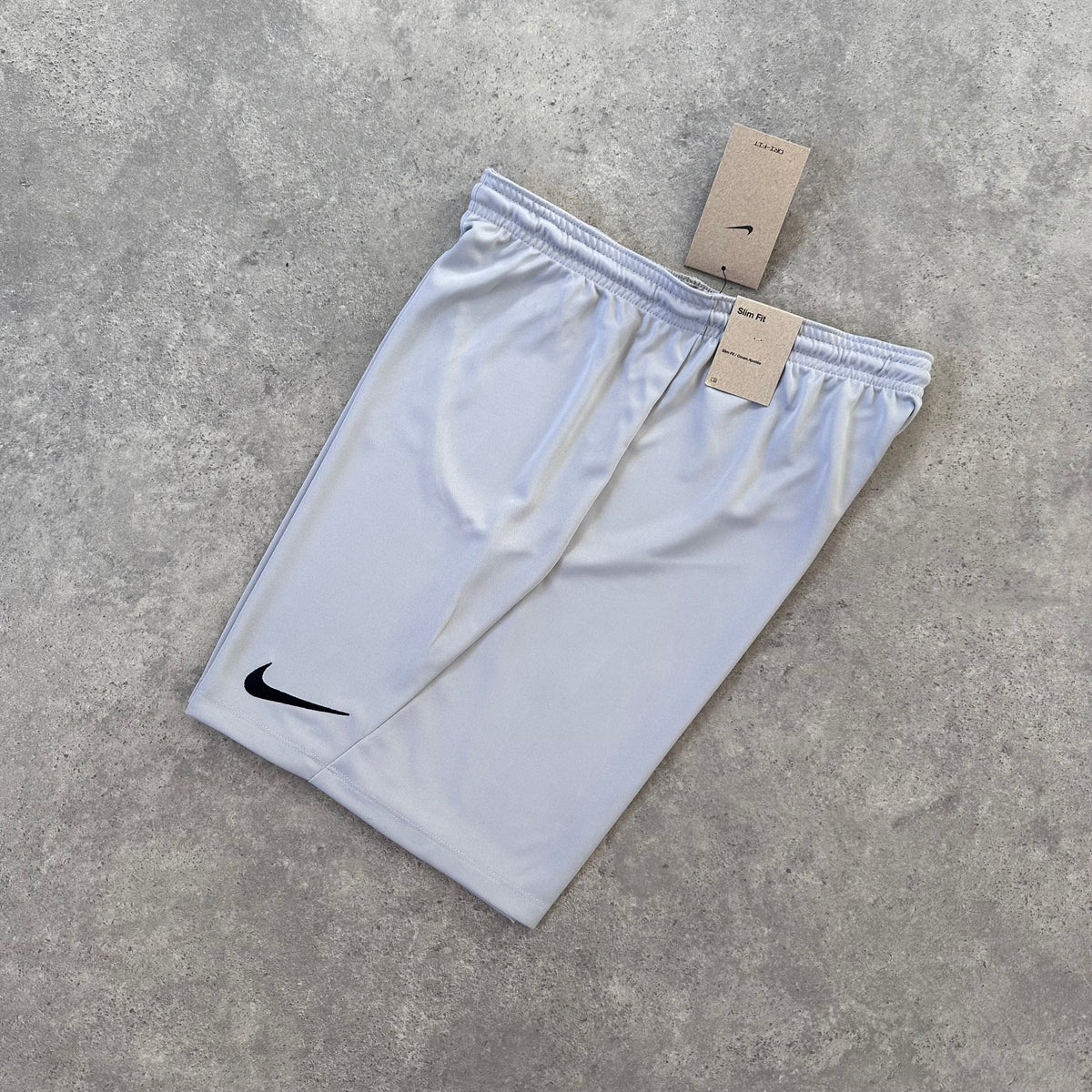 NIKE LOGO ESSENTIAL SHORTS - STONE GREY