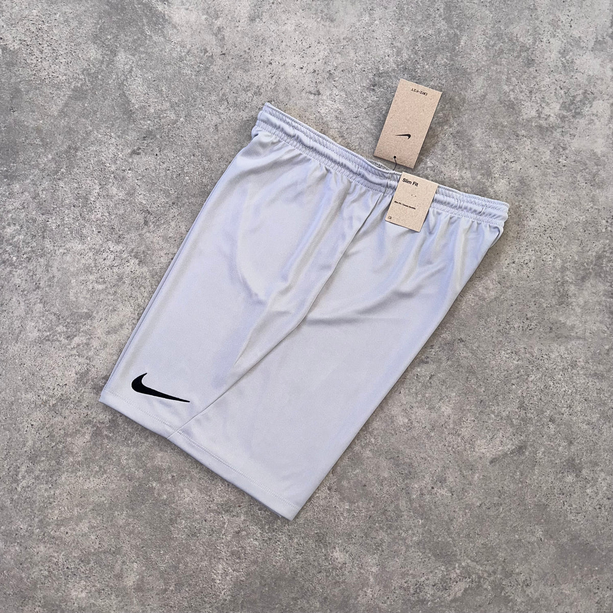 NIKE LOGO ESSENTIAL SHORTS - STONE GREY