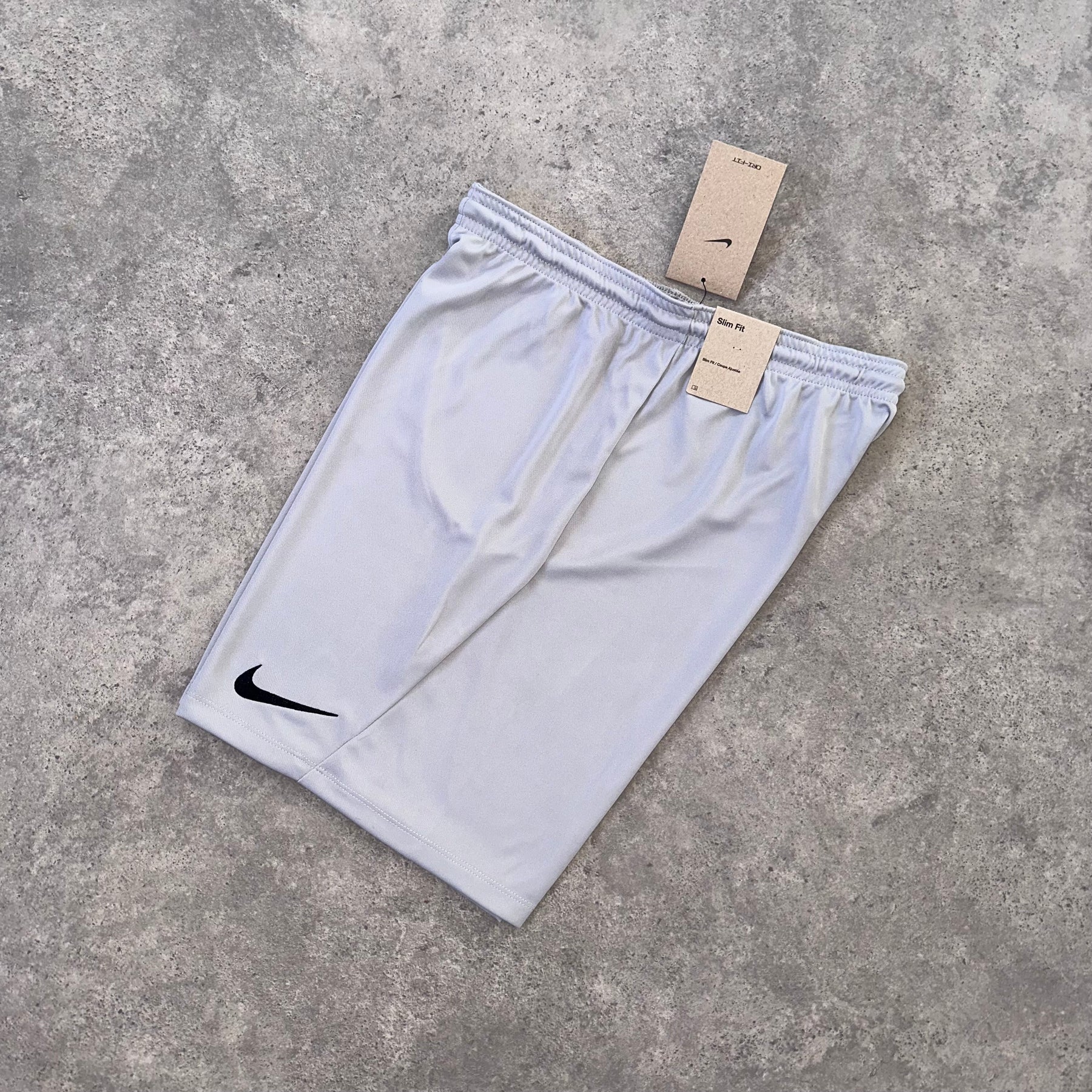 NIKE LOGO ESSENTIAL SHORTS - STONE GREY